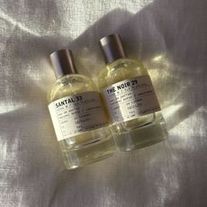 A picture of Le Labo perfumes on a white linen background