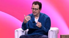 Anthropic CEO Dario Amodei speaking on stage at the "How AI Will Transform Business in the Next 18 Months" panel during INBOUND 2025 conference in San Francisco, USA.