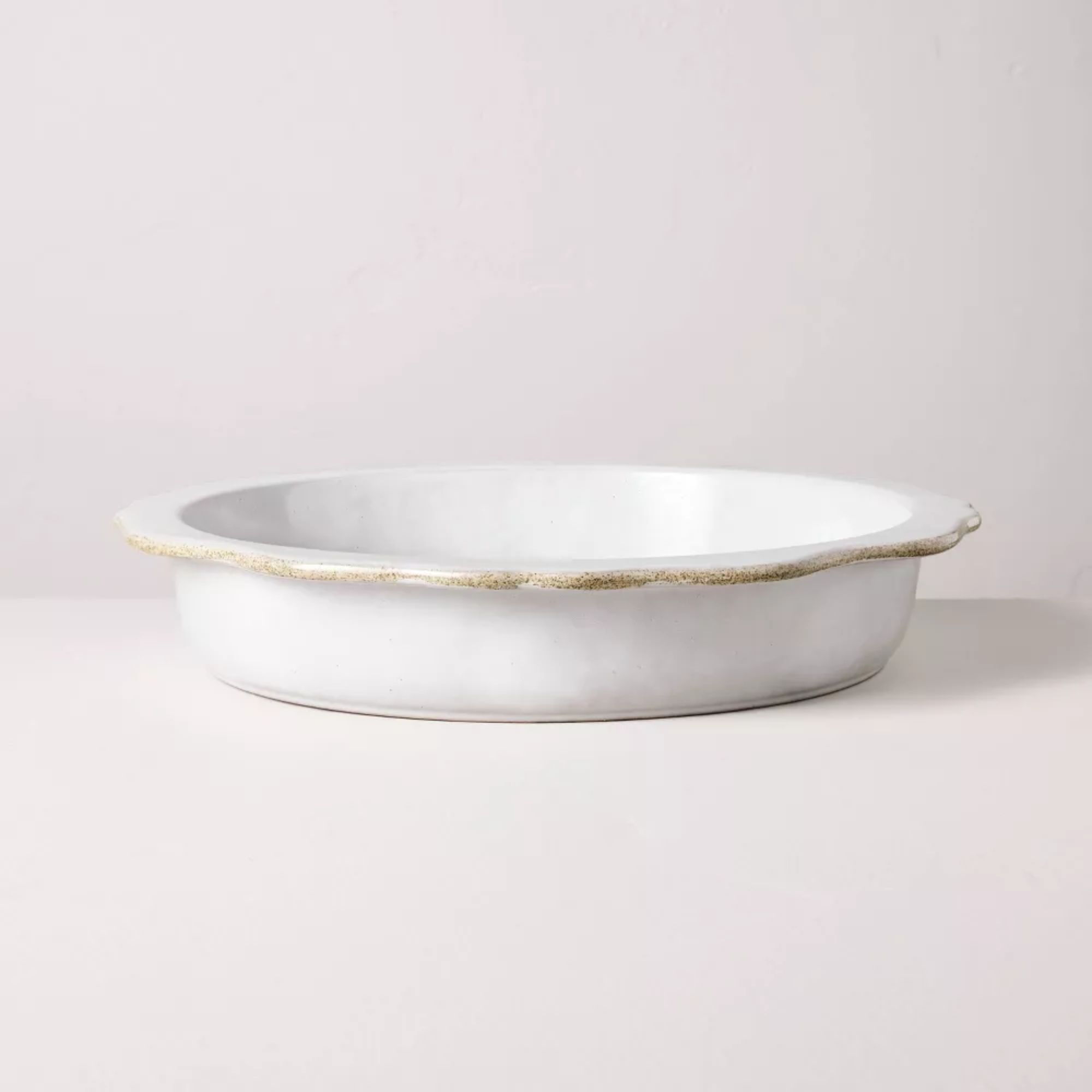 White stoneware pie dish with scalloped edges