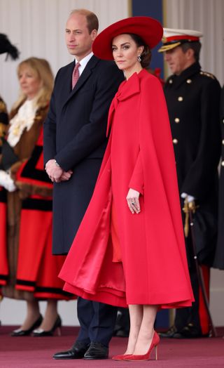 Catherine Princess of Wales wearing red cape dress