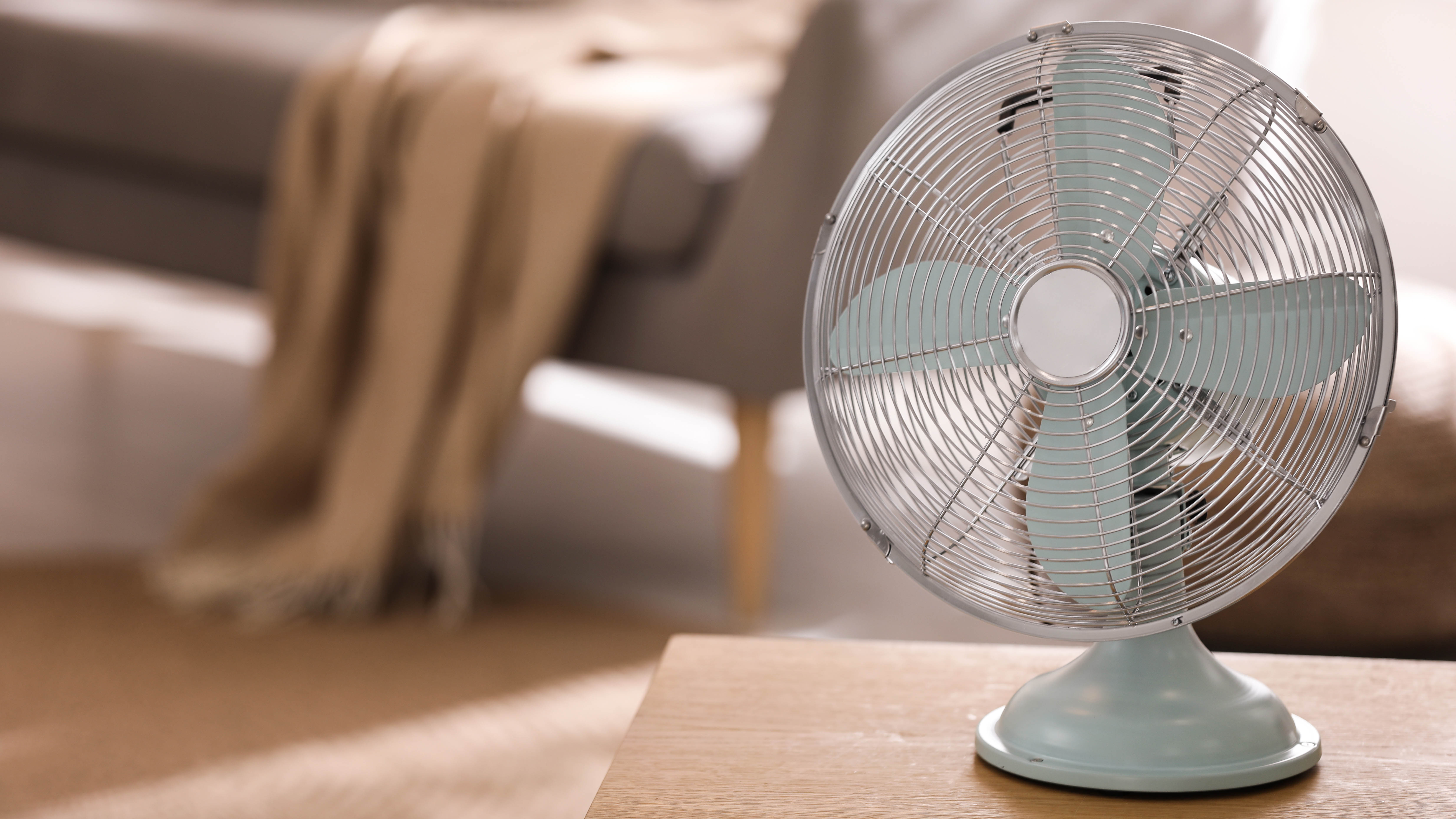 A fan sitting on a table in the living room
