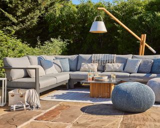 patio with corner sofa and large floor lamp