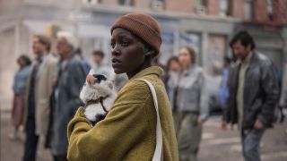 Lupita Nyong'o holding a cat in A Quiet Place: Day One