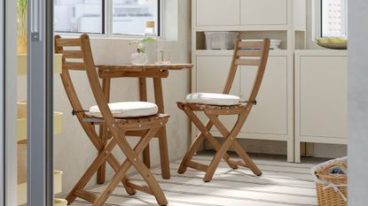 IKEA ASKHOLMEN wooden dining table and chairs set in a small flat