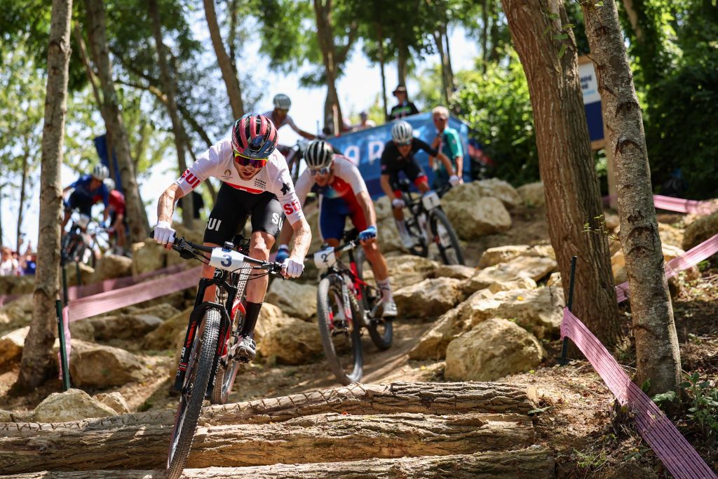 Switzerland's Mathias Flueckiger competes in the men's cross-country mountain biking event during the Paris 2024 Olympic Games in Elancourt Hill venue in Elancourt, on July 29, 2024. (Photo by Emmanuel DUNAND / AFP)