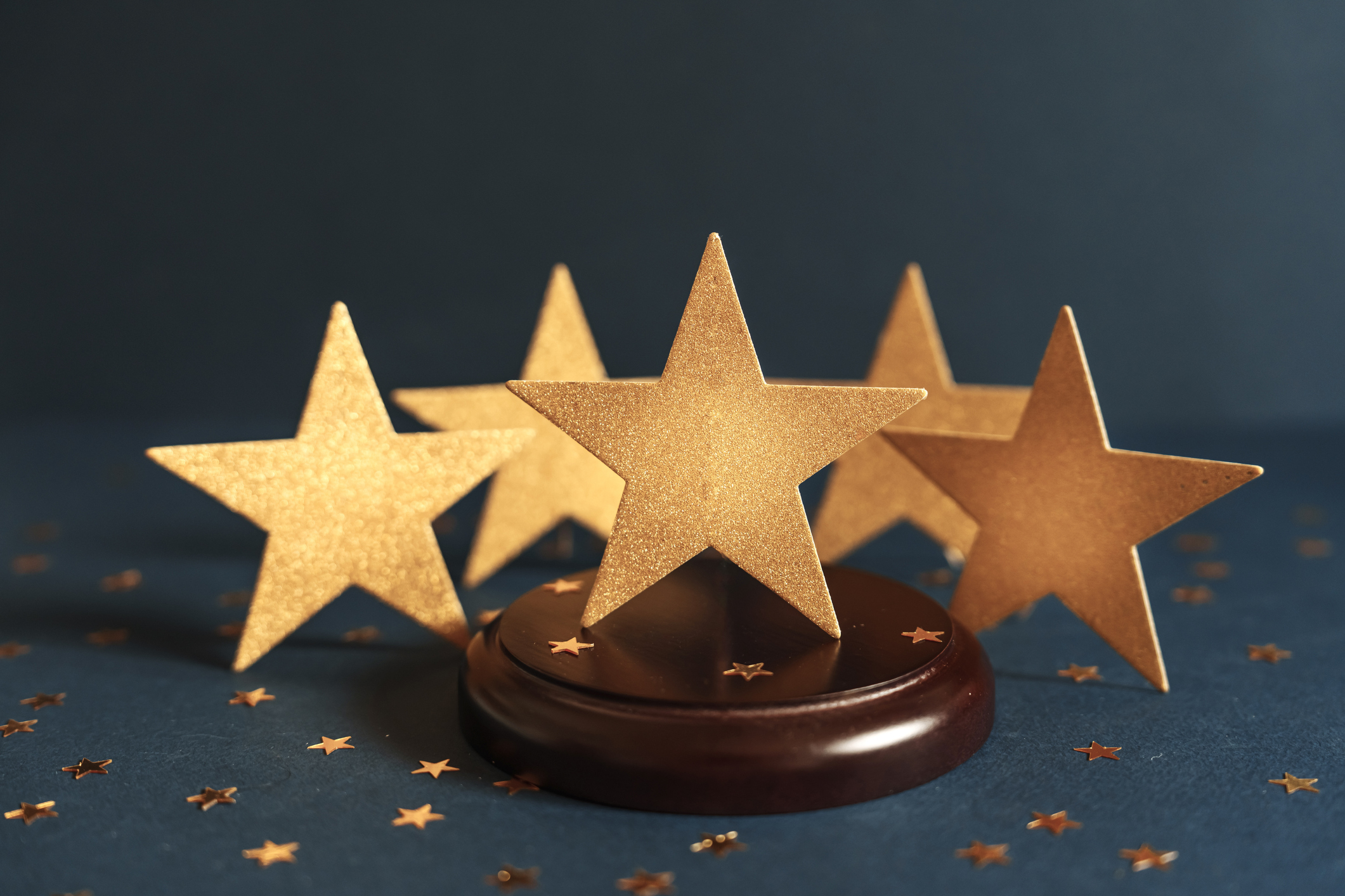 golden five star symbol representing premium success