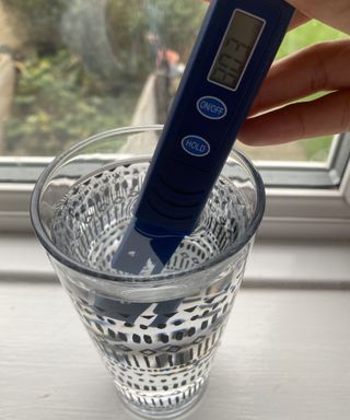 Using the ZeroWater TDS water meter in a glass of