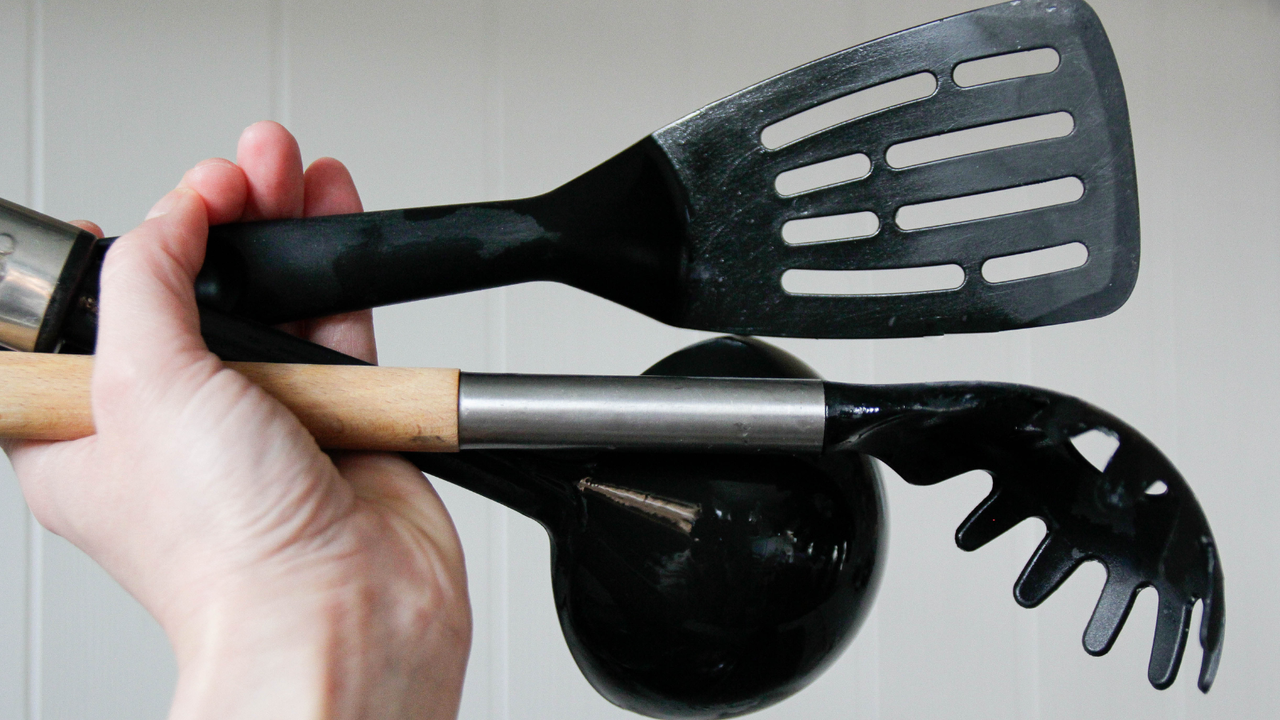 A handful of black plastic spatulas