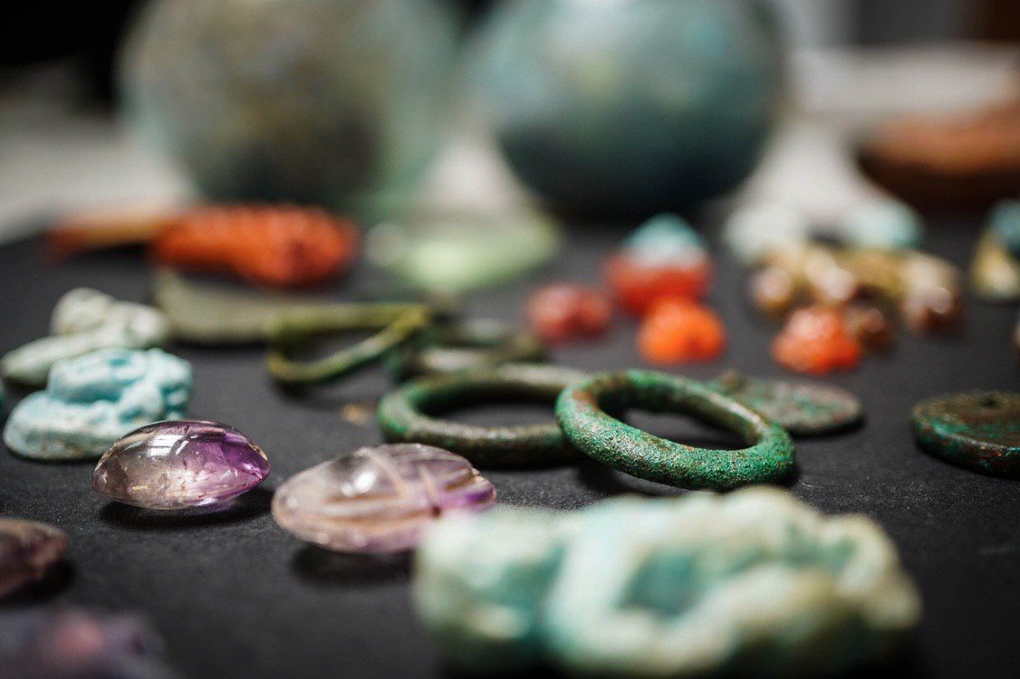 Some of the amulets were sculpted out of purple amethyst.