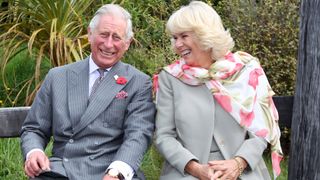 King Charles and Queen Camilla laughing