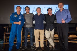 NASA astronaut Drew Feustel, at left, actor Matt Damon, director Ridley Scott, author Andy Weir, and NASA's director of planetary sciences Jim Green pose for a photo together after talking about NASA's journey to Mars and the "The Martian."