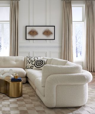 jonathan adler designed neutral living room with statement art