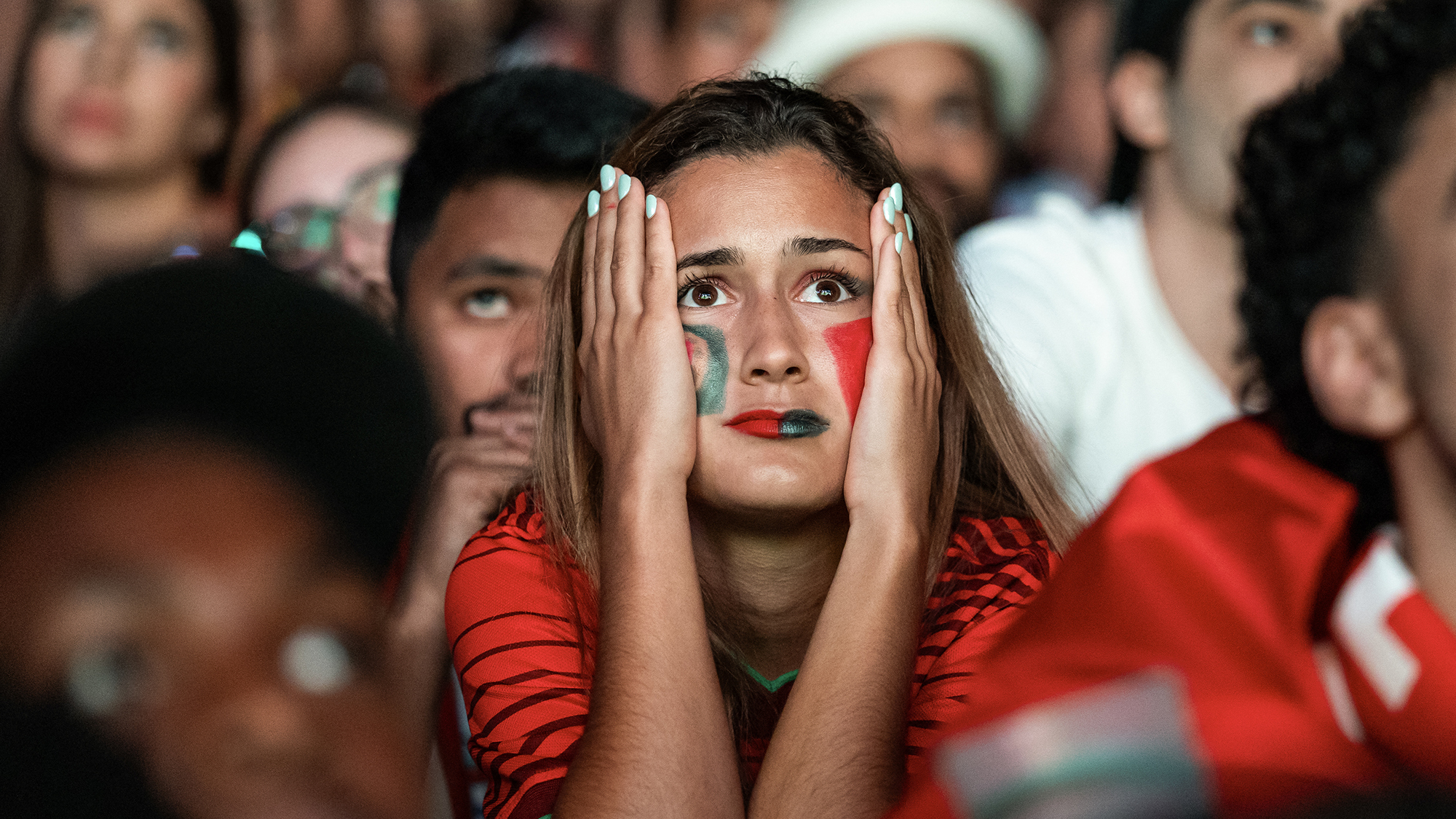A Portuguese football fan reacts while watching the Portugal vs Spain 2026 World Cup match played in Arlington, Texas, at Pra&amp;ccedil;a do Com&amp;eacute;rcio in Lisbon, Portugal