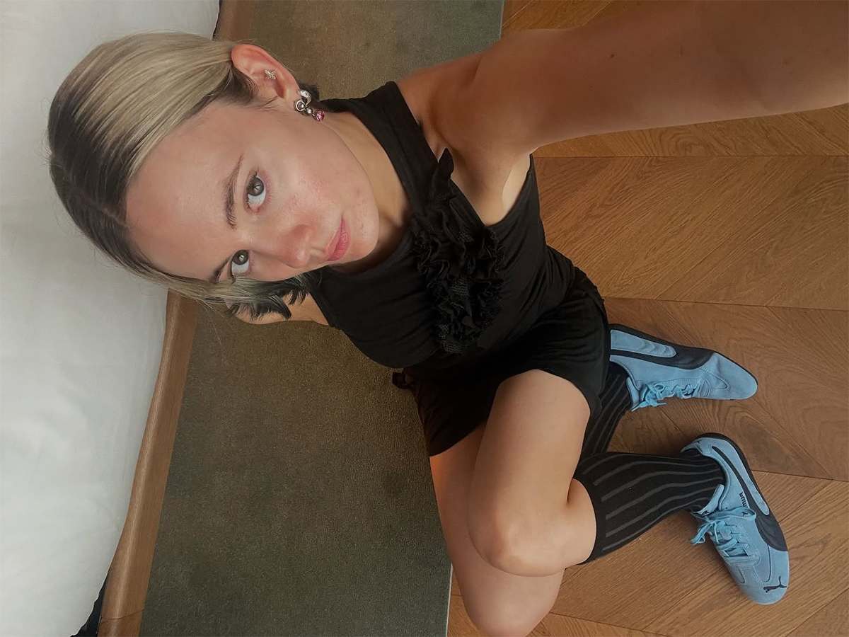 Influential Susie Garvie wore black and blue Puma sneakers.