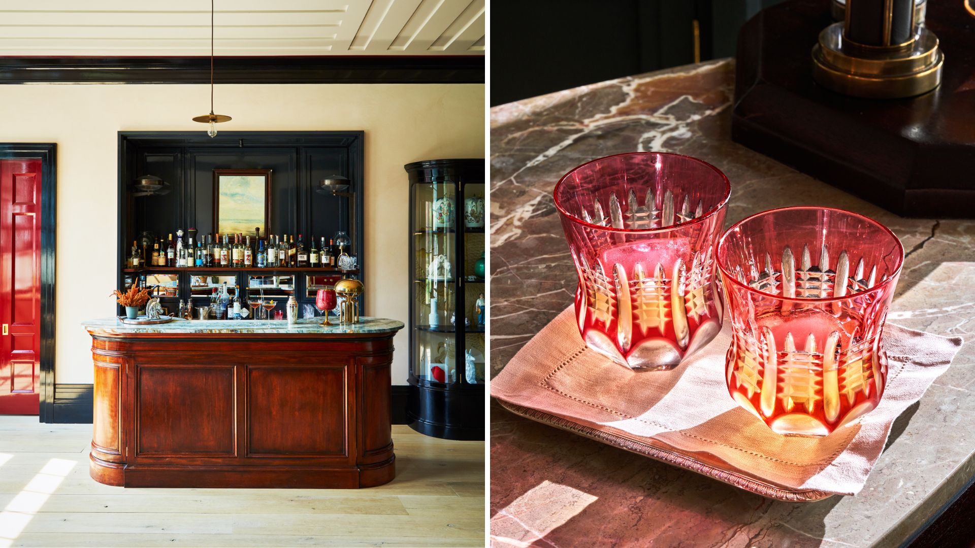 A wooden home bar and two red cut glasses on a napkin