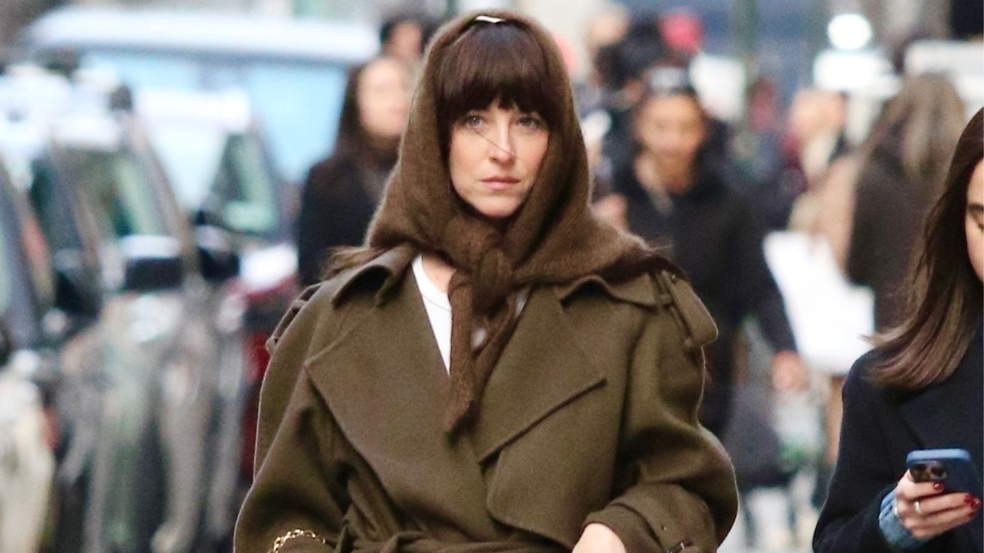 dakota johnson in new york wearing a triangle scarf
