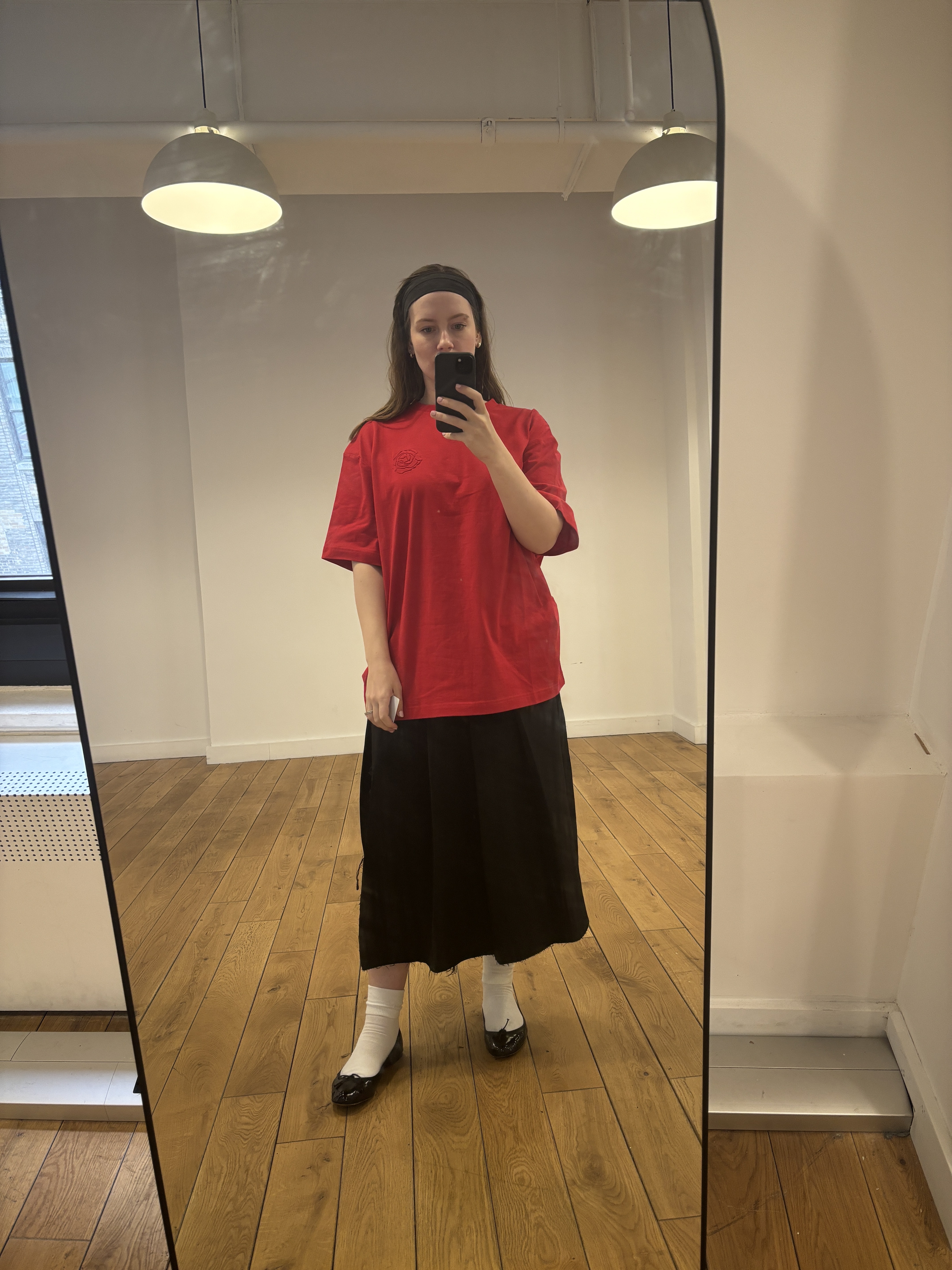 Halie LeSavage wears Magda Butrym x H&M in a mirror selfie