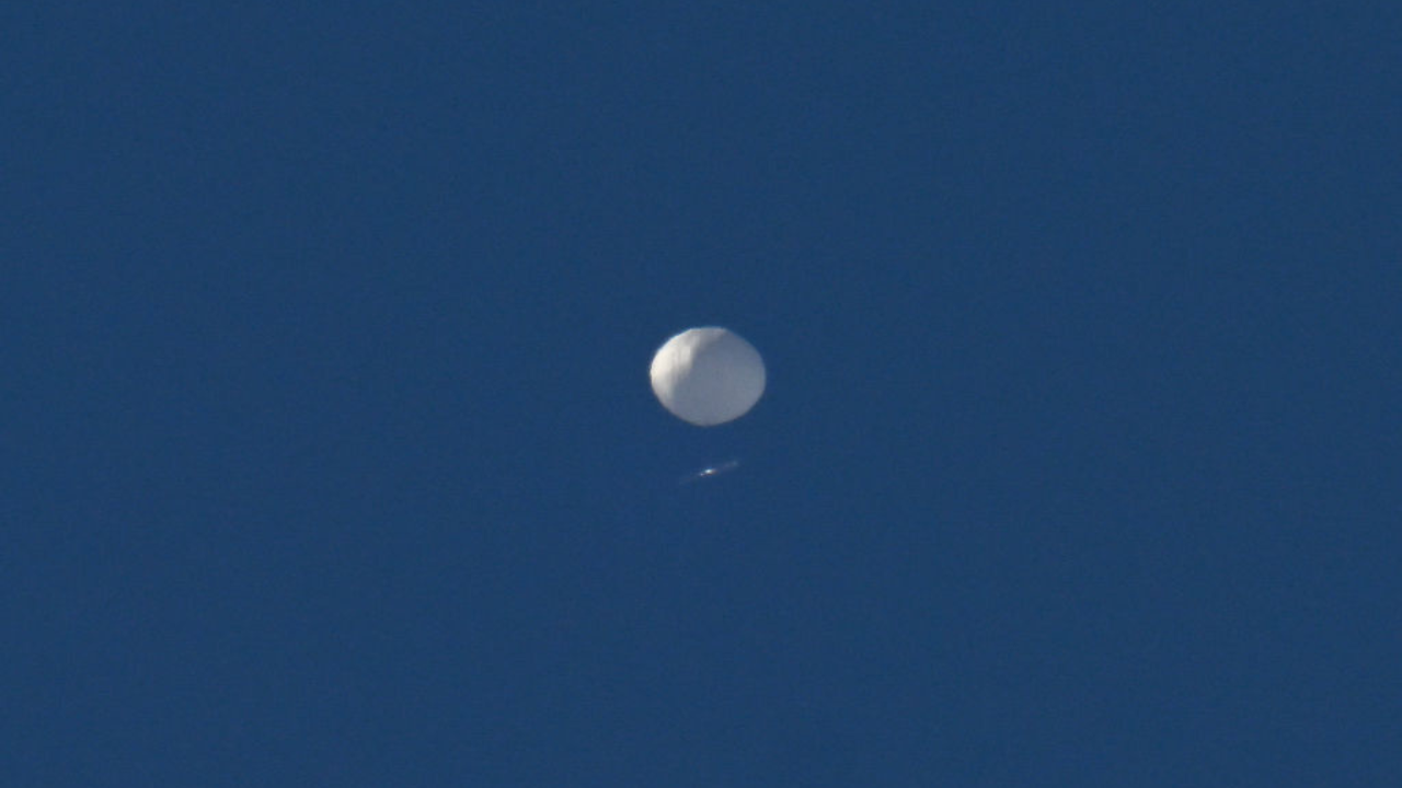 A big white balloon is pictured flying above Charlotte, North Carolina