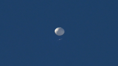 A big white balloon is pictured flying above Charlotte, North Carolina