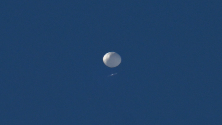 A big white balloon is pictured flying above Charlotte, North Carolina