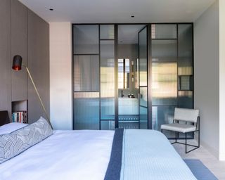 Bedroom with en suite with fluted glass privacy doors