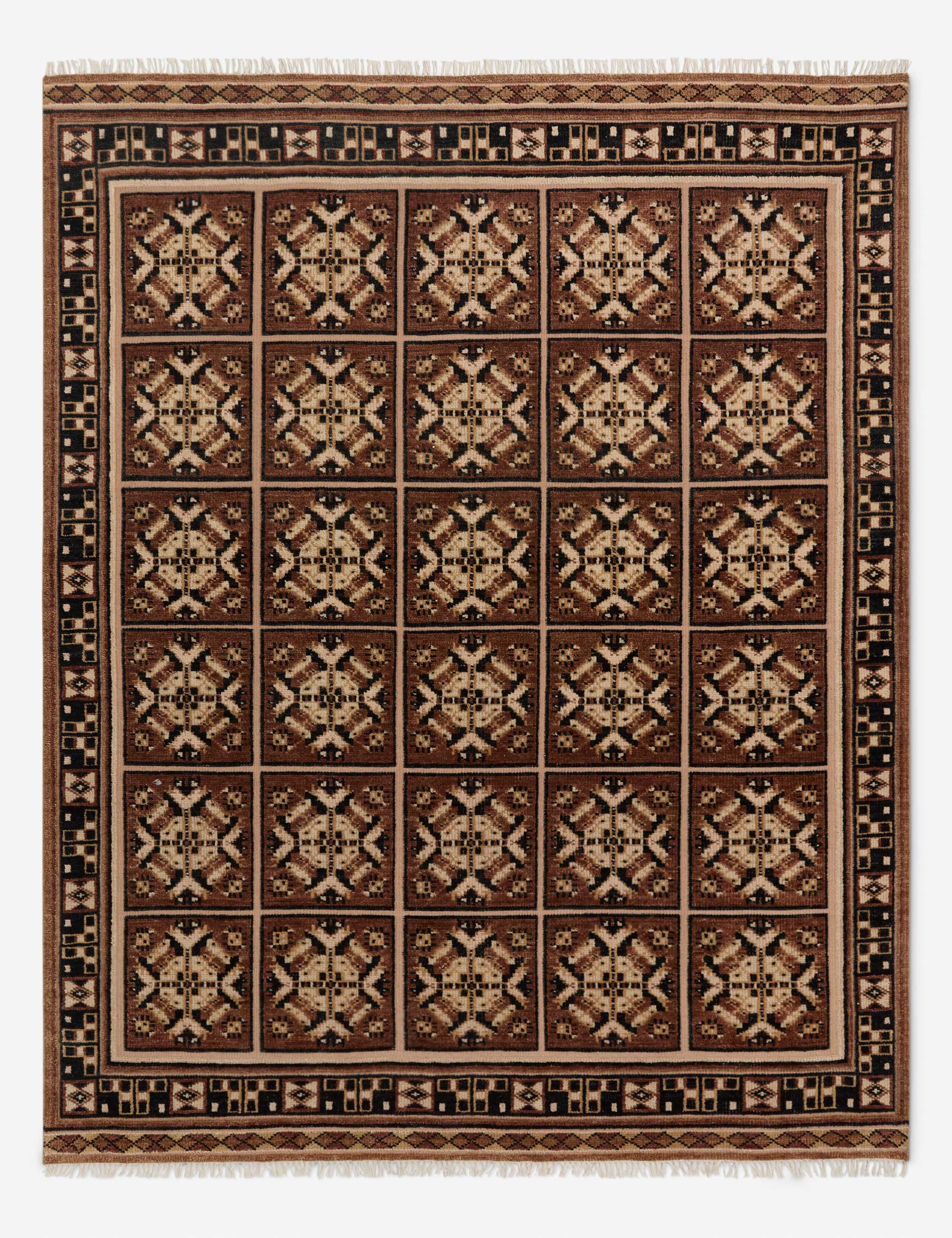 Lulu and Georgia heritage-inspired, geometrically patterned rug in a neutral brown color palette