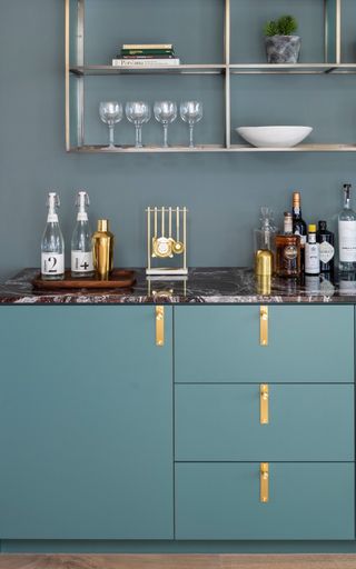 A home bar with added elements of brassware