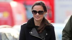 Pippa Middleton smiles as she walks in London wearing an aviator jacket and sunglasses in 2012