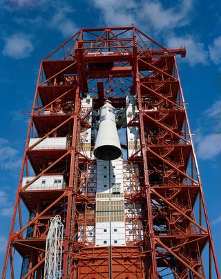 Apollo Spacecraft 12 is hoisted to the top of the gantry at Pad 34 during the Apollo/Saturn Mission 204 (later known as Apollo 1) erection