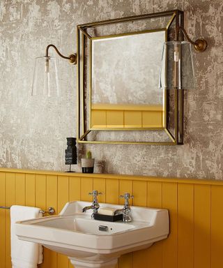 A bathroom mirror idea by Pooky with textured wall decor and yellow shiplap