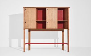 Wooden cabinet with red interior