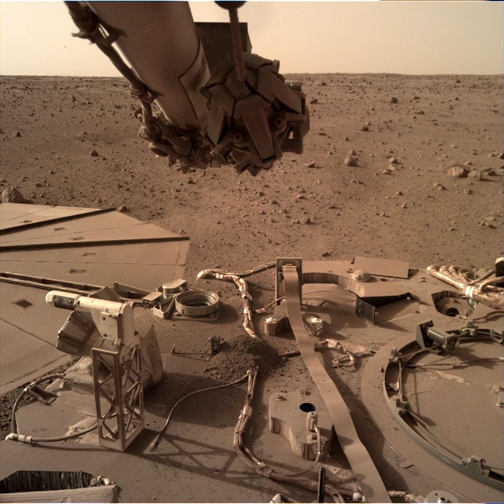 Dust has been building up on NASA&#039;s InSight Mars lander, as shown by this photo taken by the spacecraft’s Instrument Deployment Camera on Feb. 13, 2022.