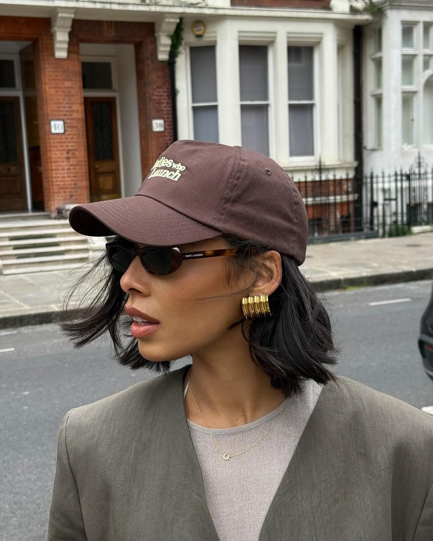 Rochelle Humes wearing a brown cap with a blunt short bob hairstyle