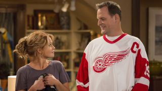 Candace Cameron Bure as DJ looks at Dave Coulier as Joey on Fuller House.