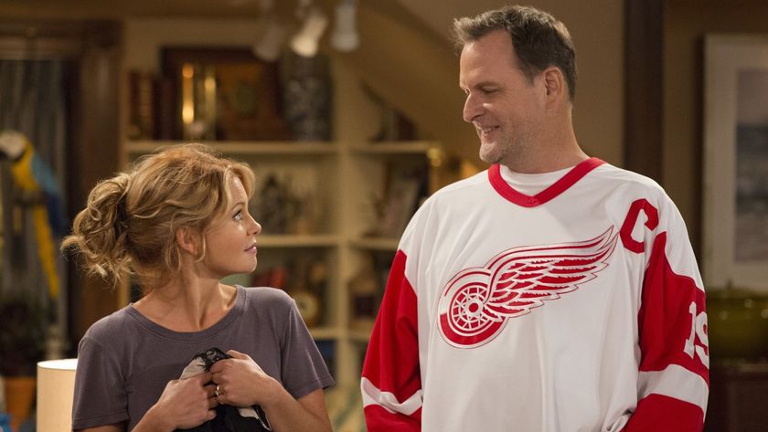 Candace Cameron Bure as DJ looks at Dave Coulier as Joey on Fuller House.