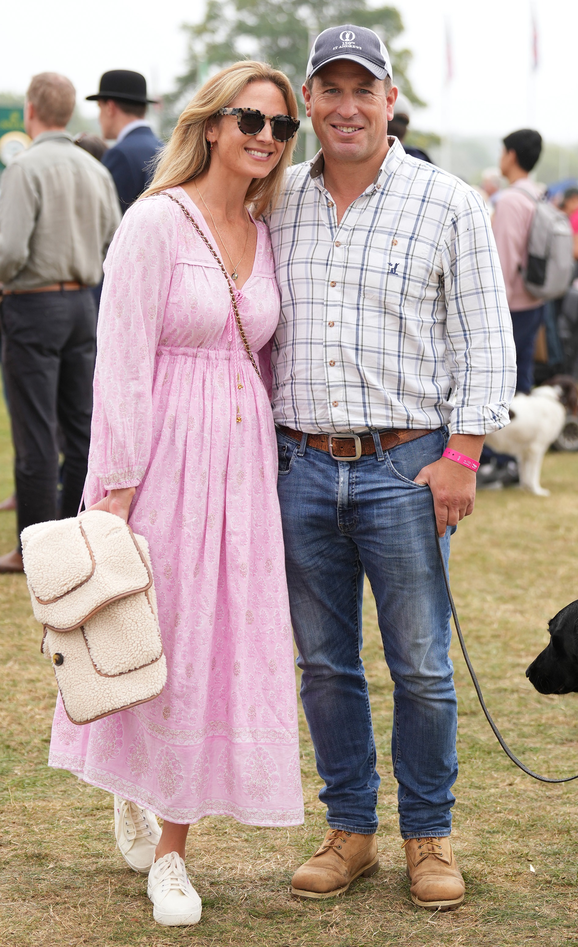 Harriet Sperling and Peter Phillips posing with their dog