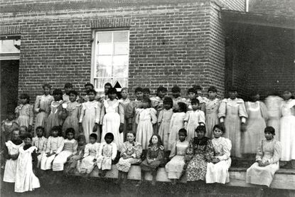 A historic photograph of students at the Fort Lewis boarding school