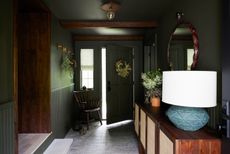 a small entryway painted dark