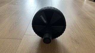 GymShark Ab Roller on wooden floor