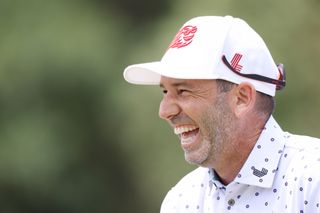 Sergio Garcia laughs at a joke whilst playing a practice round at the US Open