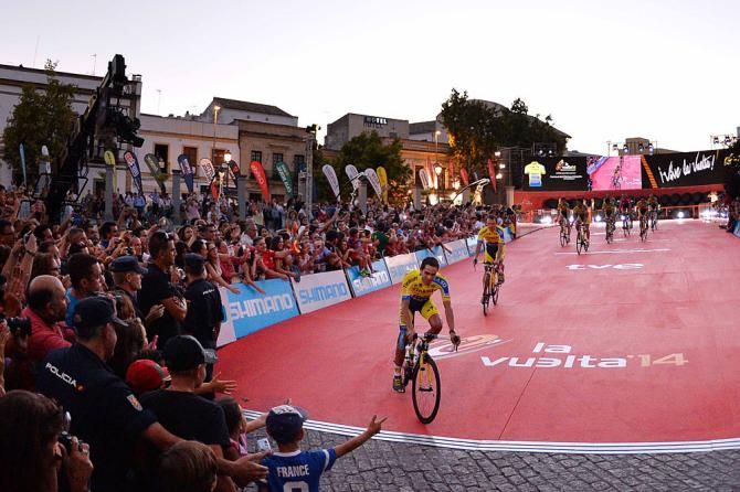 Alberto Contador rolls past fans