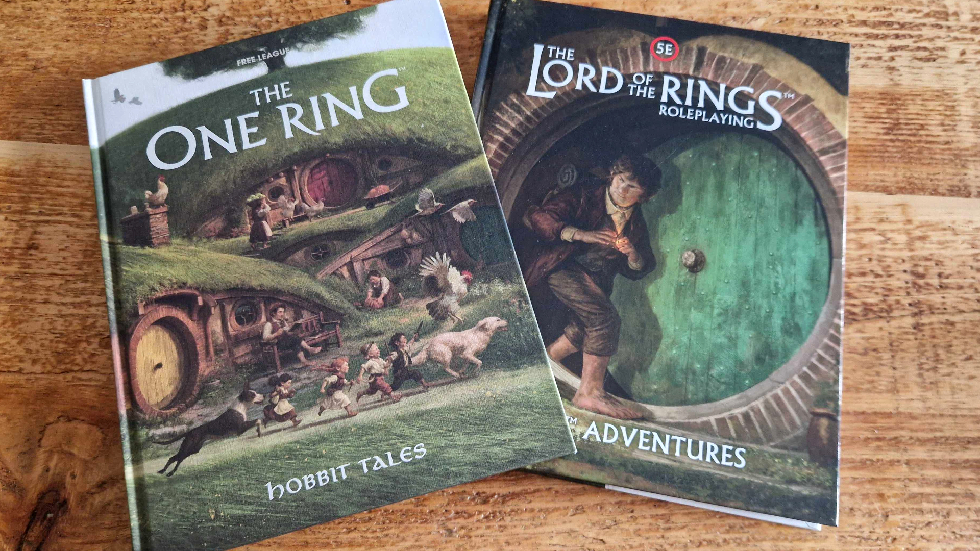 The One Ring Hobbit Tales and Lord of the Rings Roleplaying Shire Adventures on a wooden table
