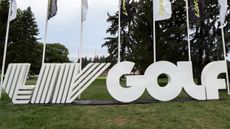 A LIV Golf sign in white at a LIV Golf tournament
