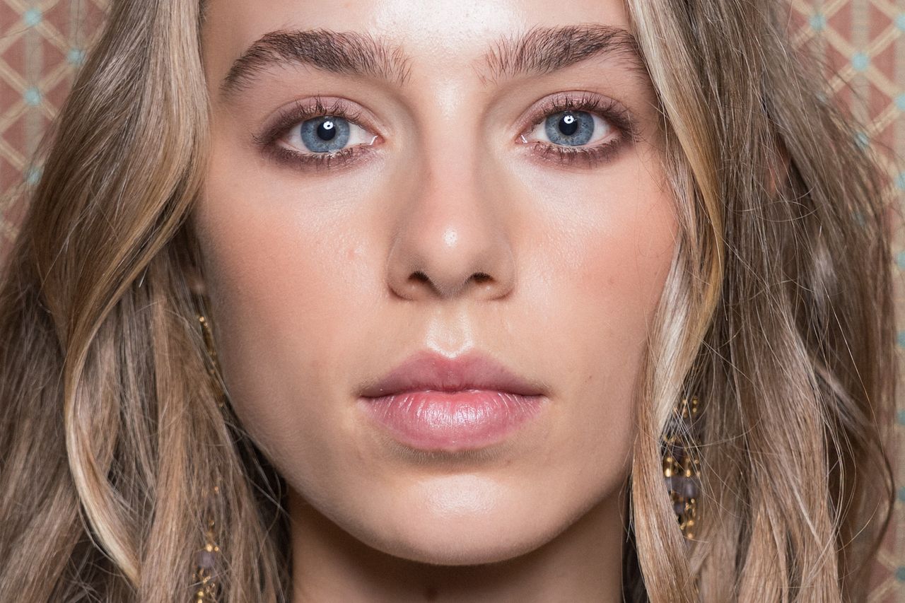 Three women with different smokey eye makeup looks ranging for subtle and neutral to bold and dramatic.