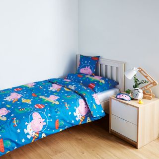 children's bedroom with blue bed and wooden flooring