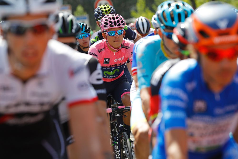 Andrey Amador (Movistar) overall leader at the Giro d'Italia, sits in the field