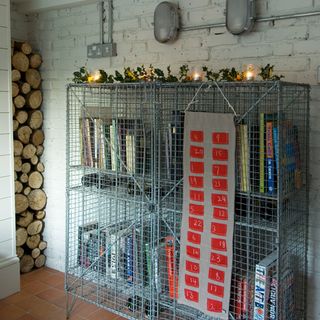 book storage with white brick wall and light