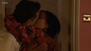 Kat Slater and Nish Panesar kissing.