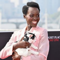 Lupita Nyong’o poses with her cat during a photocall for 'A Quiet Place: Day One'