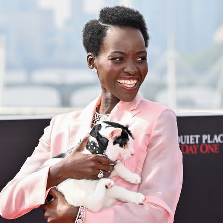 Lupita Nyong&rsquo;o poses with her cat during a photocall for 'A Quiet Place: Day One'